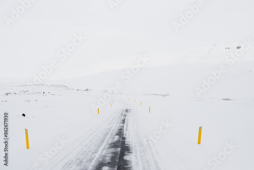 View of snow-covered road in winter, Thingeyjarsveit, Iceland. photo