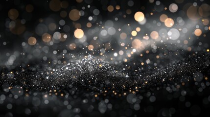 Abstract background of sparkling gold and silver glitter on a black surface.  Perfect for festive or celebratory designs.