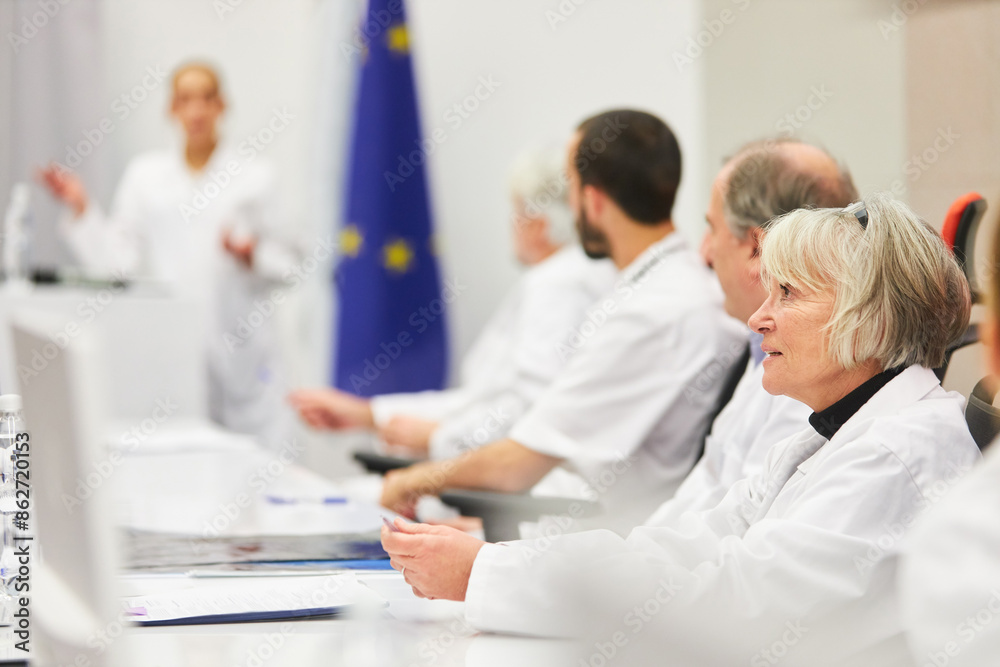 Fototapeta premium Doctors panel at medical conference presentation in auditorium