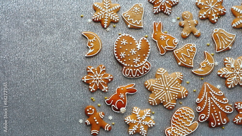 Assorted Christmas Gingerbread Cookies On Silver Textured Background