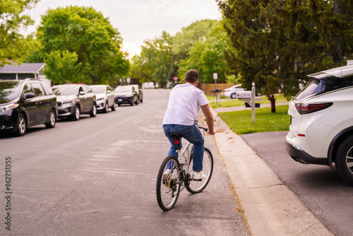 Young man riding a bicycle outdoors