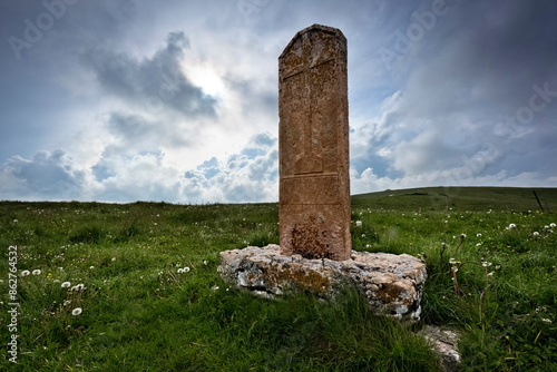 Obraz na płótnie The Norderi cross: ancient religious stone among the pastures of Lessinia. Velo Veronese, Veneto, Italy. w salonie
