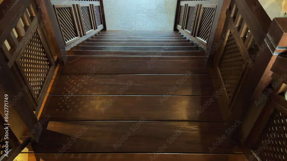 Pov walk down the elegant wooden staircase in a modern building design Pov walk down the elegant wooden staircase in a modern building design