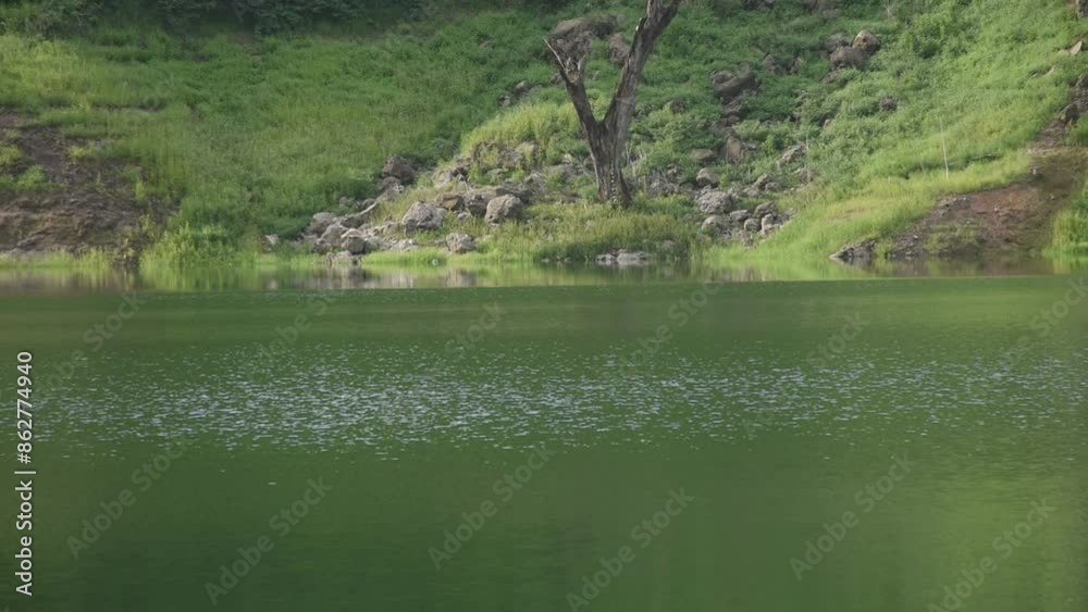landscape of Klong Klang water reservoir lake with mountain background in Thailand