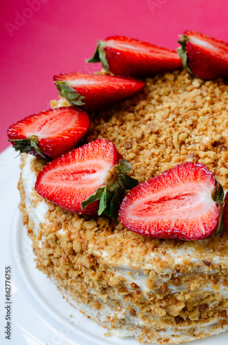 Crepe cake Medovik with sour cream vanilla cream and strawberries. Pancake cake Medovik decorated with strawberries.