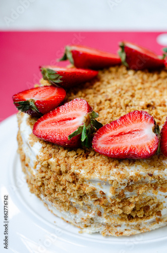 Crepe cake Medovik with sour cream vanilla cream and strawberries. Pancake cake Medovik decorated with strawberries.