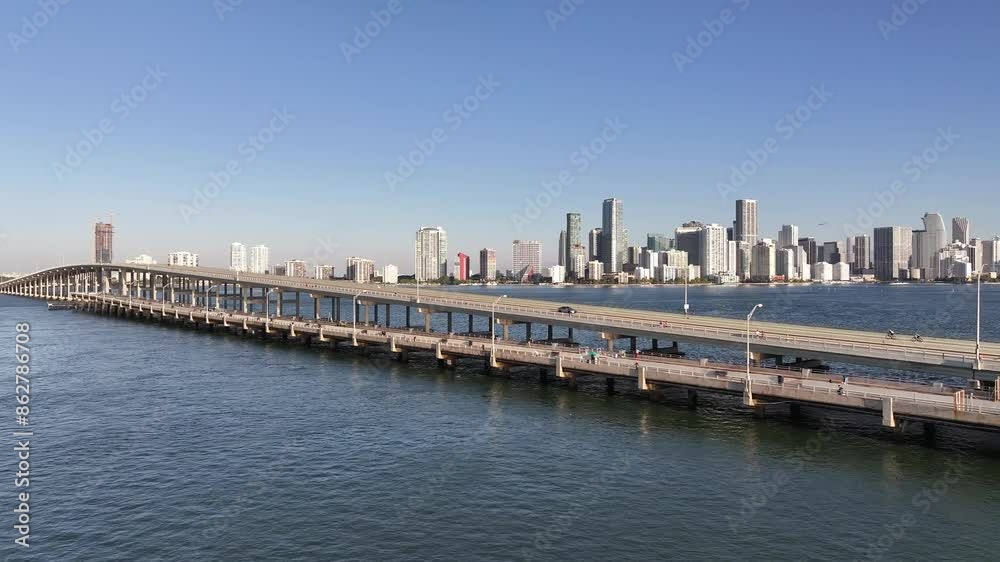 Aerial view of modern Miami skyline with Rickenbacker Causeway and Biscayne Bay, Florida, United States. Aerial view of modern Miami skyline with Rickenbacker Causeway and Biscayne Bay, Florida, United States.