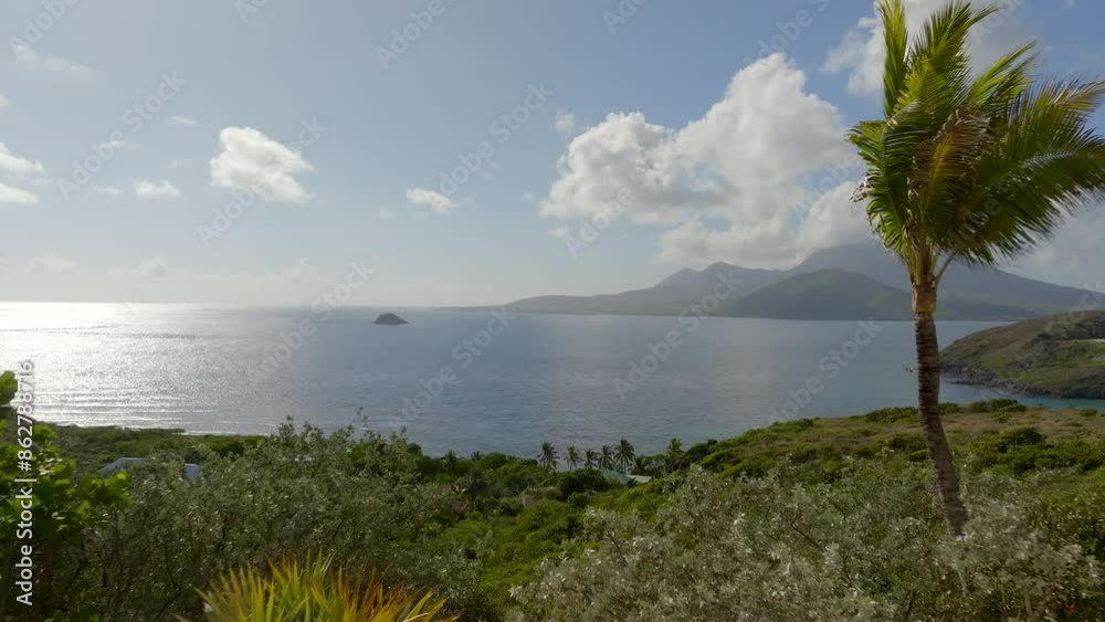 Aerial view of tropical coast with lush vegetation and serene ocean, Frigate Bay, St Kitts and Nevis. Aerial view of tropical coast with lush vegetation and serene ocean, Frigate Bay, St Kitts and Nevis.