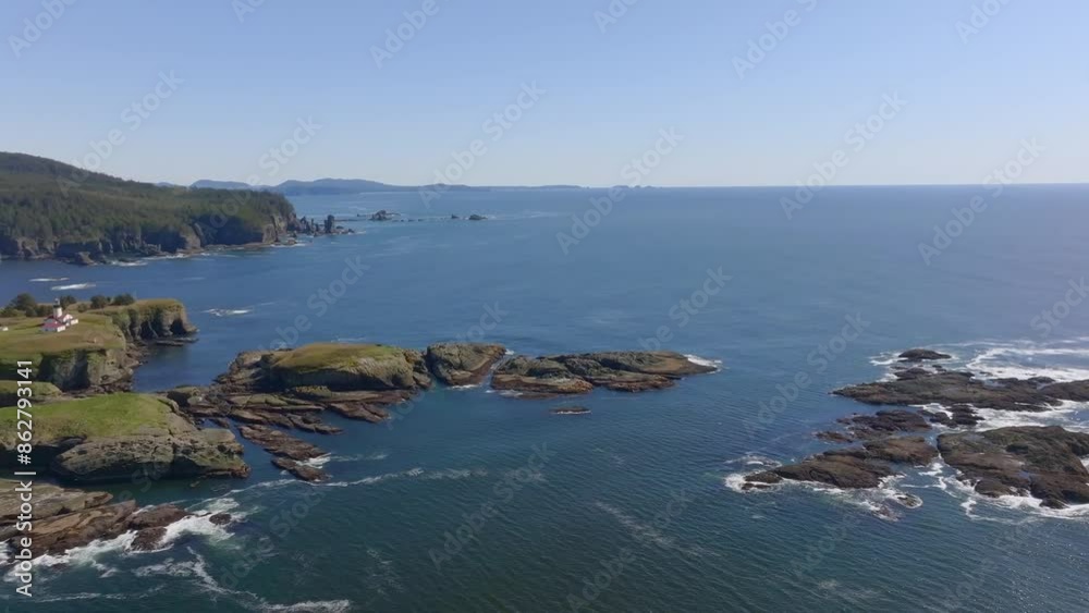 Aerial view of rocky shore and Cape Flattery Lighthouse, Pacific Ocean, Strait of Juan de Fuca, Cape Flattery, Washington, United States. Aerial view of rocky shore and Cape Flattery Lighthouse, Pacific Ocean, Strait of Juan de Fuca, Cape Flattery, Washington, United States.