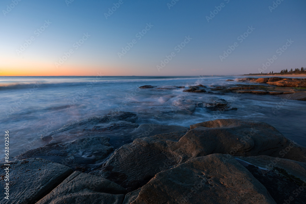 Rock and water seascape view at dawn. Rock and water seascape view at dawn.