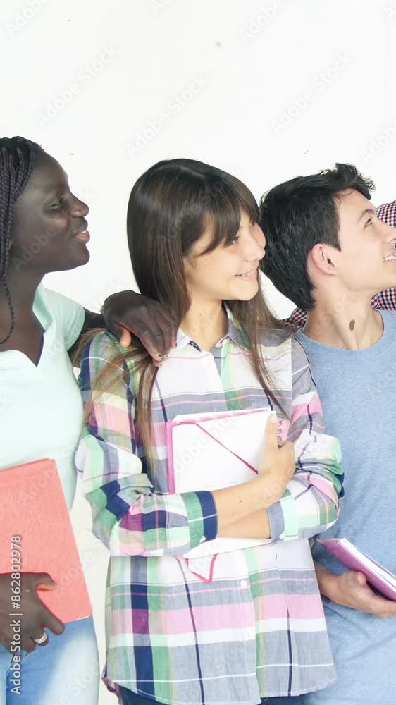 Five teenagers of multi races and their teacher isolated on a white wall. Vertical Video Five teenagers of multi races and their teacher isolated on a white wall. Vertical Video