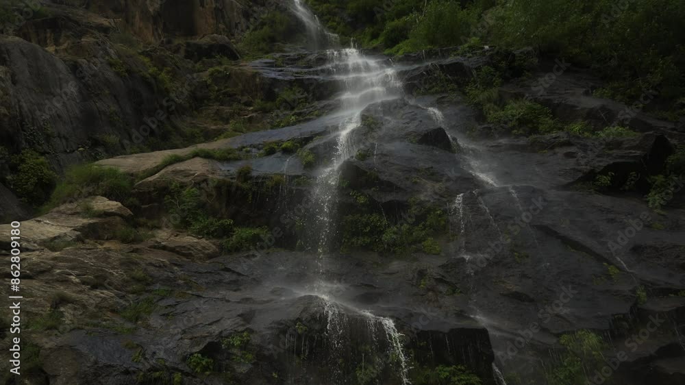 Water flows down the rocks from above Water flows down the rocks from above