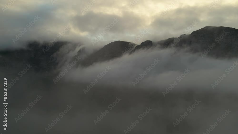 Aerial view of misty mountain and dramatic sky, Hout Bay, Cape Town, South Africa. Aerial view of misty mountain and dramatic sky, Hout Bay, Cape Town, South Africa.