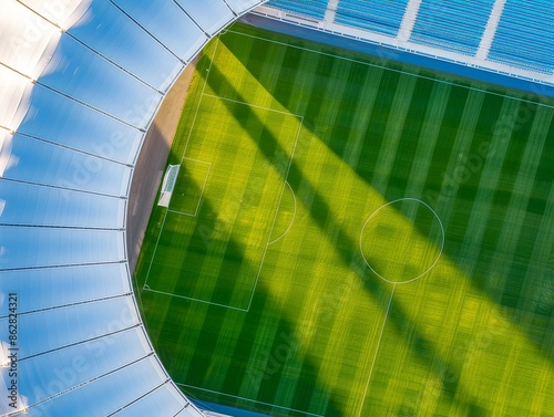 aerial view of a football stadium with green grass and white lines. photo