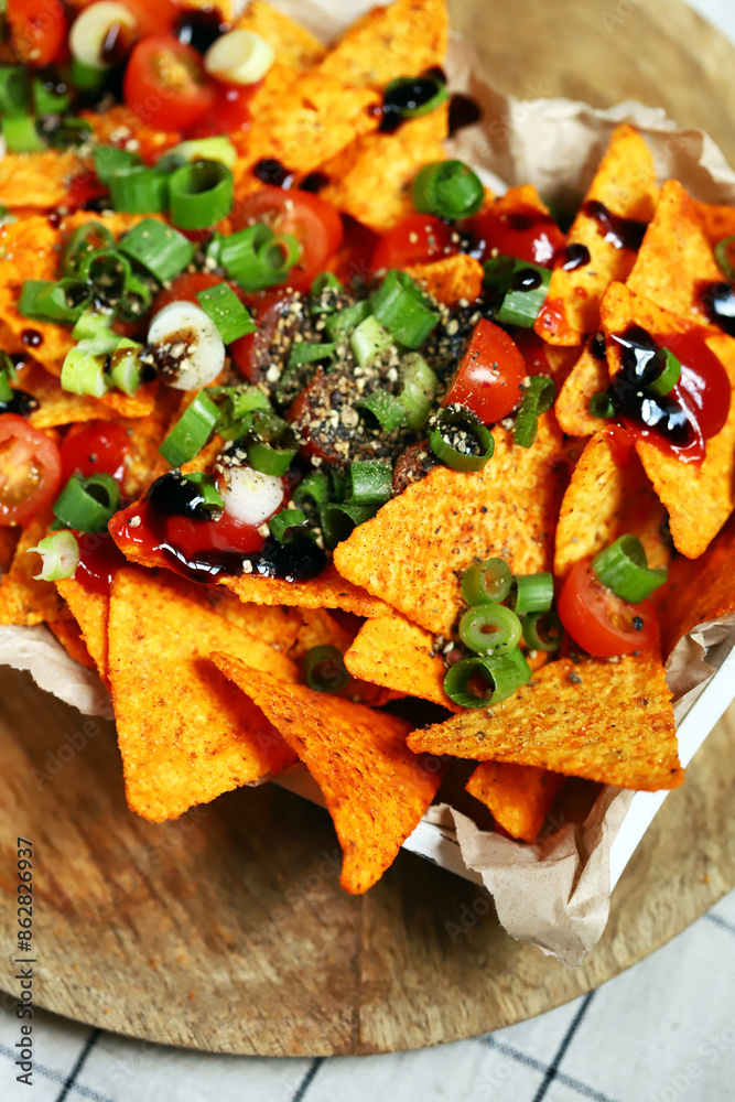 Nacho chips with green onions and spices.