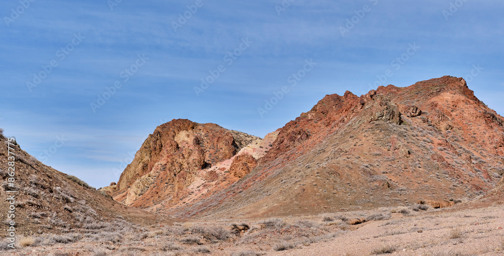 Fototapeta premium Colored sandy soil of hills over background of blue sky in Charyn Canyon National Park in Kazakhstan
