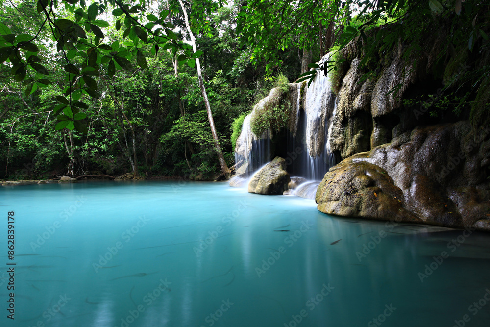 Tropical landscape waterfall with beautiful emerald lake and rocks in wild jungle forest. Erawan National park, Kanchanaburi Province, Thailand Tropical landscape waterfall with beautiful emerald lake and rocks in wild jungle forest. Erawan National park, Kanchanaburi Province, Thailand
