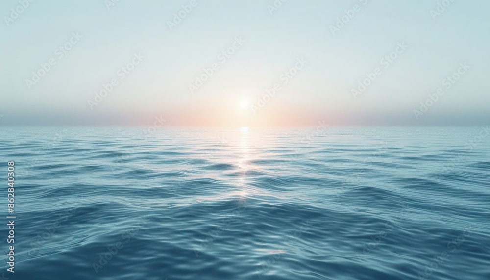 Obraz premium The setting sun casts a golden glow on the gently undulating waves.