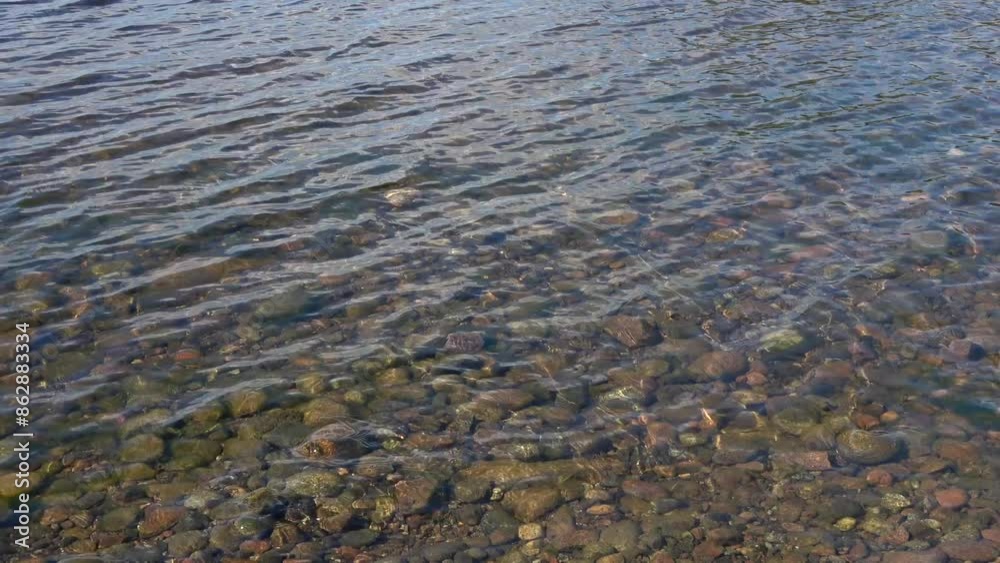 Shallow waves in shallow water. Lake in Karelia Shallow waves in shallow water. Lake in Karelia