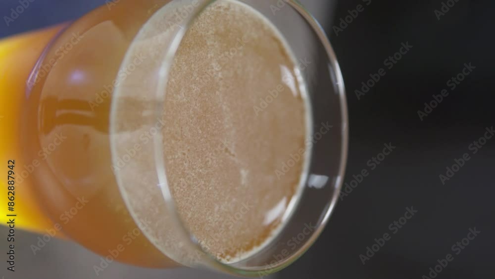 Close-up of a glass of frothy cold beer on a bar counter. Beer store, tasting. Concept for brewery, bar, festival. Vertical shot. Close-up of a glass of frothy cold beer on a bar counter. Beer store, tasting. Concept for brewery, bar, festival. Vertical shot.