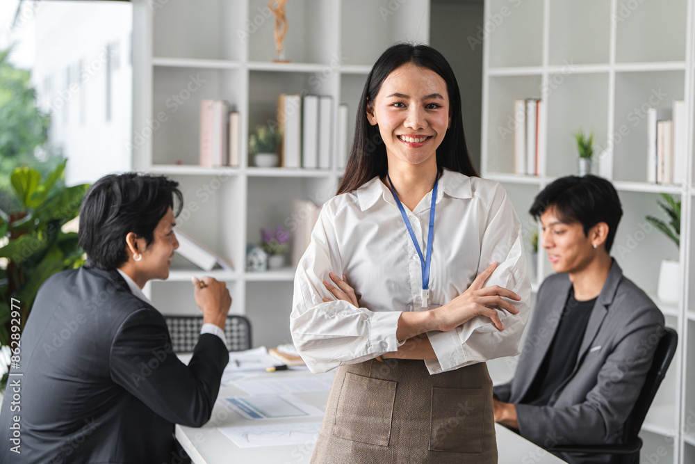 Confident Business Woman Leading a Meeting in a Modern Conference Room with Colleagues Confident Business Woman Leading a Meeting in a Modern Conference Room with Colleagues