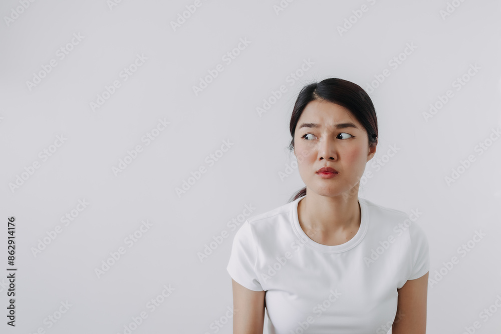 Asian Thai woman doubt and curious face, have question thinking and looking at empty space, isolated on white background wall. Asian Thai woman doubt and curious face, have question thinking and looking at empty space, isolated on white background wall.