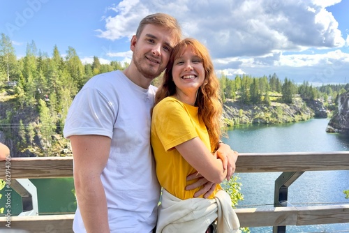 beautiful young couple, family outdoors in Karelia, Ruskeala. eco tourism concept, travel, summer photo