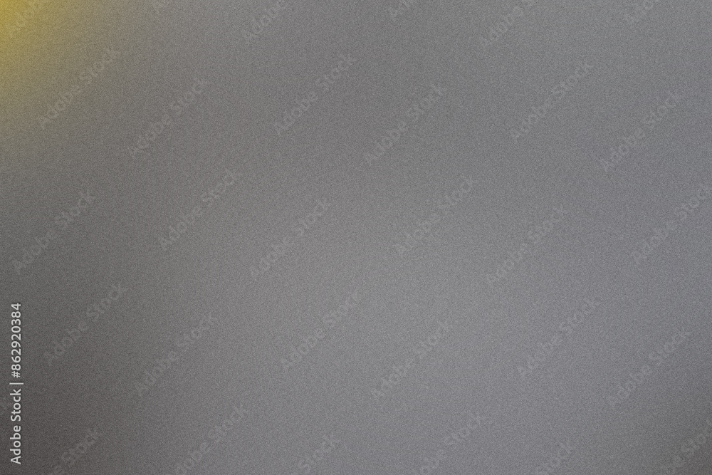Grainy gray background featuring a gradient with a fading yellow light in the top left corner Grainy gray background featuring a gradient with a fading yellow light in the top left corner