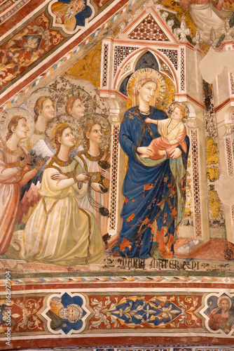 Fotografija ASSISI, ITALY - MAY 17, 2024: The detail of gothic ceiling fresco - Madonna with the angels - in the church Basilica di Santa Chiara by Giotto school - Maestro Espressionista di Santa Chiara (1337)