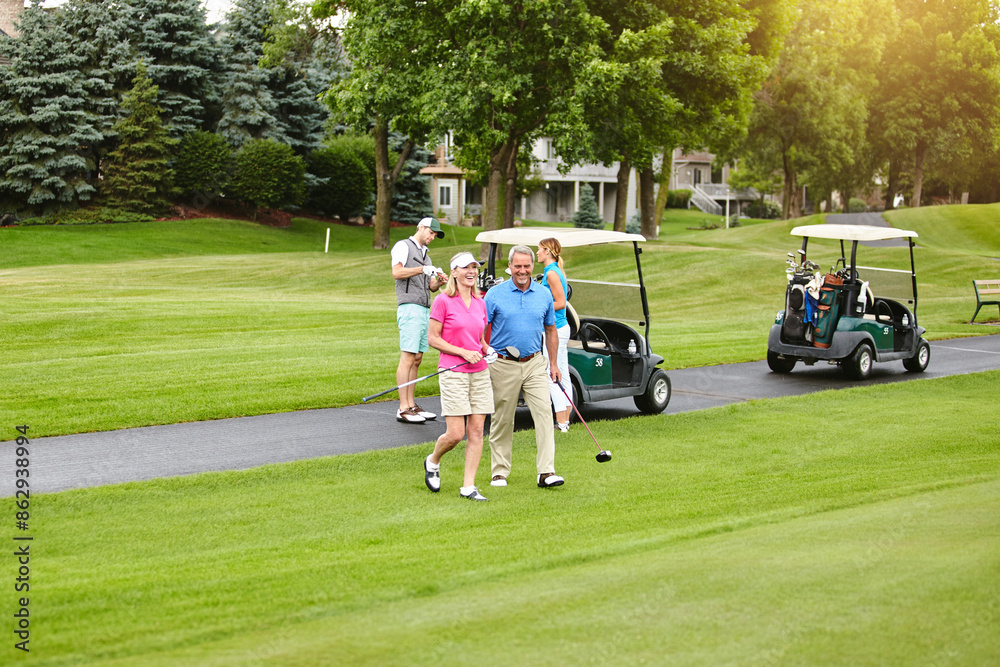 Walking, mature couple and golf outdoor with friends for fitness competition, support and hobby training. Happy, man and woman with love for game practice, bonding and care and sports exercise Walking, mature couple and golf outdoor with friends for fitness competition, support and hobby training. Happy, man and woman with love for game practice, bonding and care and sports exercise