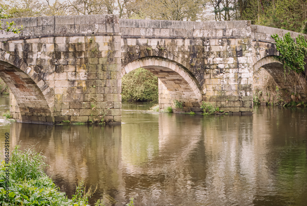 Fototapeta premium Tranquil Reflections at the Ancient Brandomil Bridge