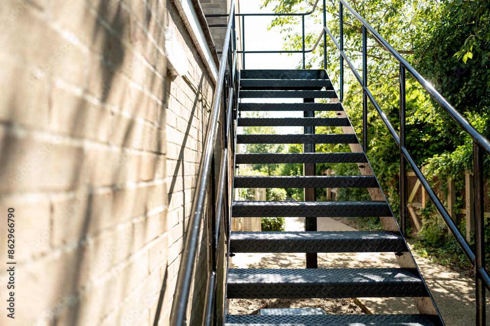 Recently painted metal fire escape steps seen on the side of a social ...