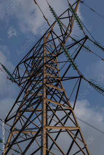 High voltage electric tower line pylon for distribution of electricity from powerstations to customers through national power grid photo