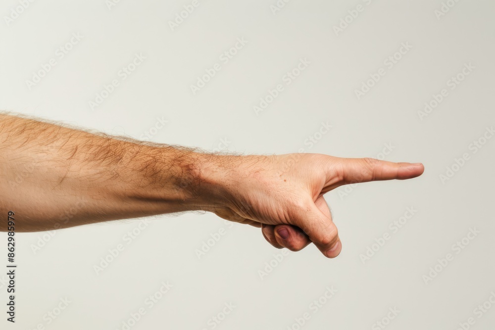 Pointing Gesture: Hand Gesturing to Highlight Something on a White Background, Signifying Attention and Explanation. Man's Hand. Copy Space. Pointing Gesture: Hand Gesturing to Highlight Something on a White Background, Signifying Attention and Explanation. Man's Hand. Copy Space.