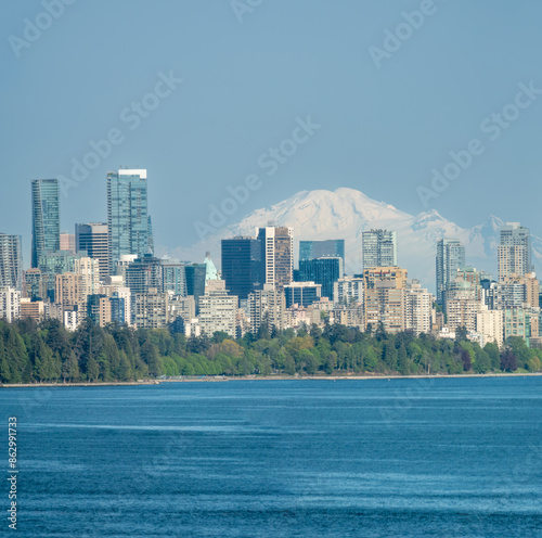 In a clear day, Mounta Rainier appers very close to the city of Stanley Park, the city of Vancouver, British Columbia, Canada photo