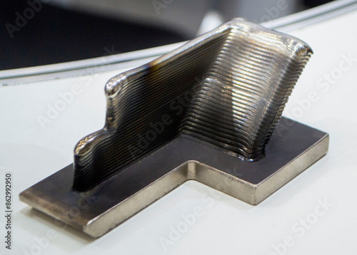 Object printed by 3D printer from metal. Additive manufacturing solution. Object created on 3Dprinter from melting metal thread. 3D Metal Printing. Metal additive manufacturing