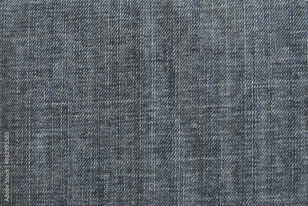 Gray washed denim texture close up as background Gray washed denim texture close up as background