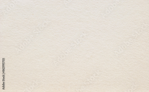 A sheet of beige rough cardboard texture as background
