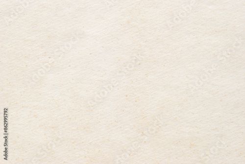 A sheet of beige rough cardboard texture as background