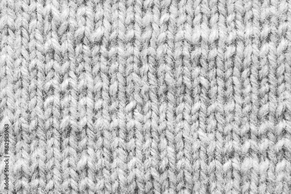 Gray woolen knitted pattern as background Gray woolen knitted pattern as background