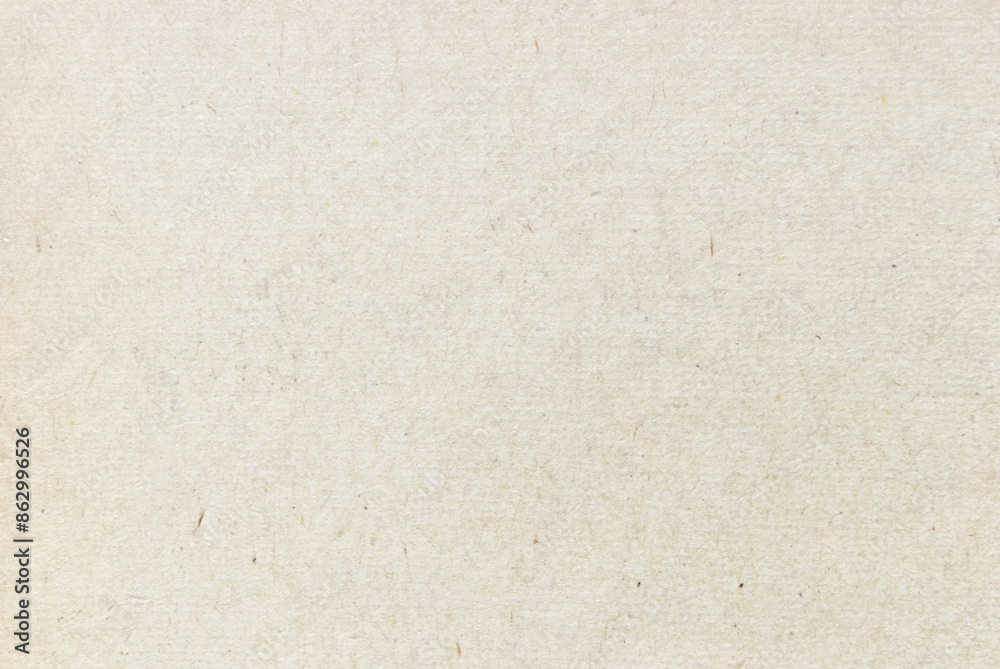 A sheet of beige recycled cardboard texture as background A sheet of beige recycled cardboard texture as background