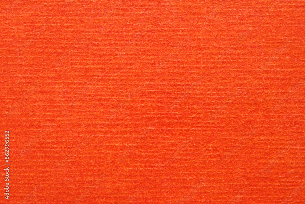 Fototapeta premium A sheet of orange corrugated texture as background