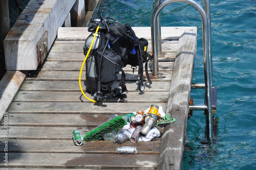 They are engaging in marine debris retrieval from floating waste.