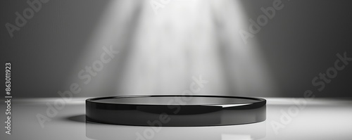 A black pedestal illuminated by a spotlight.