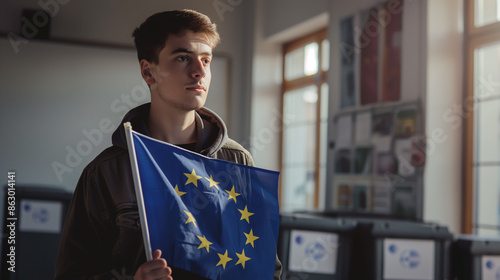 Jovem segura uma bandeira da União Europeia numa sala com urnas, simbolizando a democracia e o voto na Europa. photo