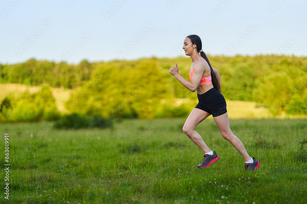 Latin girl running on a trail in the forest Latin girl running on a trail in the forest
