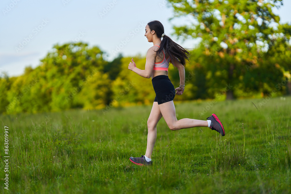 Latin girl running on a trail in the forest Latin girl running on a trail in the forest