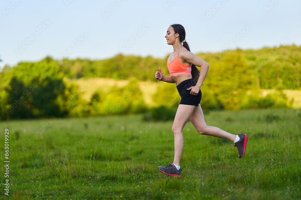 Latin girl running on a trail in the forest Latin girl running on a trail in the forest