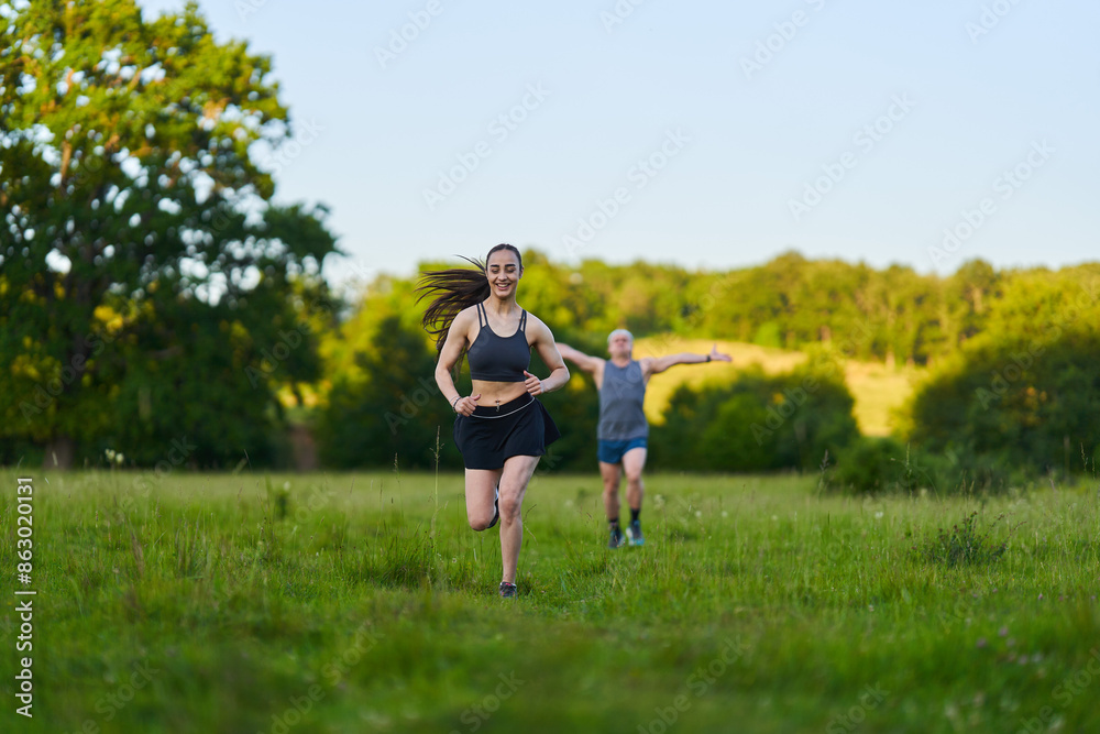 Fitness couple jogging in the forest Fitness couple jogging in the forest