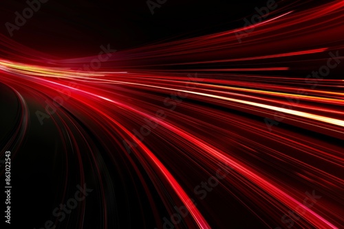 Abstract red lines depict the speed of the road in red. Red light trails on a dark background, with a high speed and fast motion blur effect.